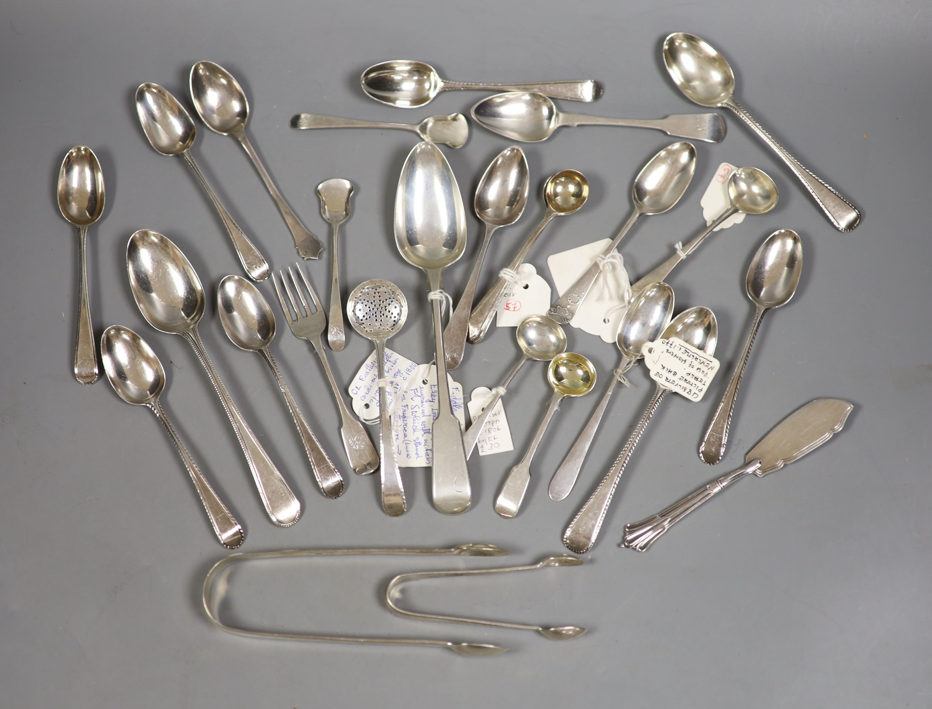 A small quantity of assorted mainly 19th century and later silver flatware including teaspoons, dessert spoon, sugar tongs, butter knife sifter spoon etc. various date and makers, 13.5oz.